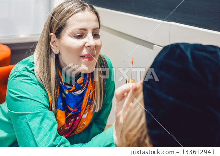 Two beautiful women met in a cafe and started talking and discussing cosmetics 133612941