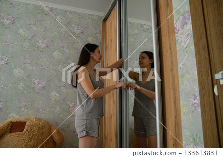Morning Routine of a Young Woman at Home 133613831