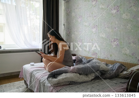 Morning Routine of a Young Woman at Home 133613845