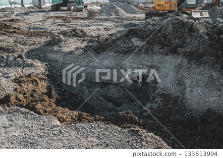 Foundation removal work at a demolition site 133613904