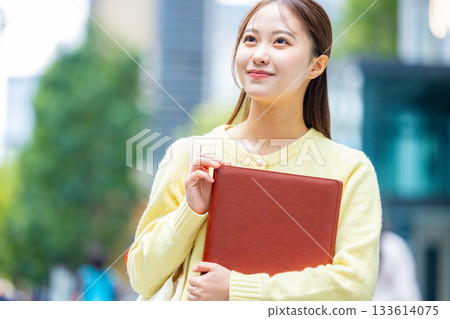 Businesswoman holding a file Businesswoman holding a file 133614075
