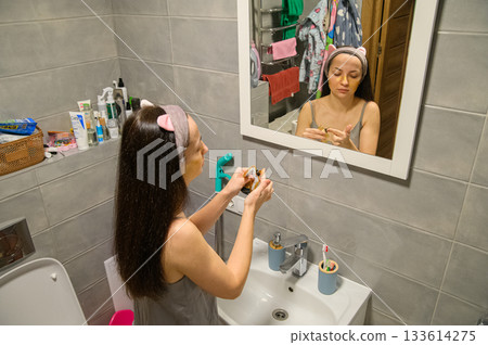 Daily Skincare Routine at Home in the Bathroom Daily Skincare Routine at Home in the Bathroom 133614275