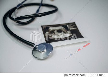Stethoscope is there. Picture of ultrasonic test is on the white table, conception of healthcare 133614859