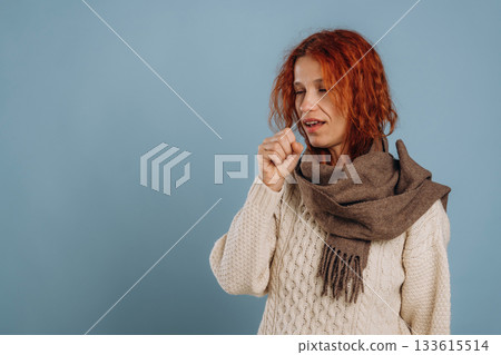 Unhealthy, feeling sick. Woman is in the studio against background 133615514