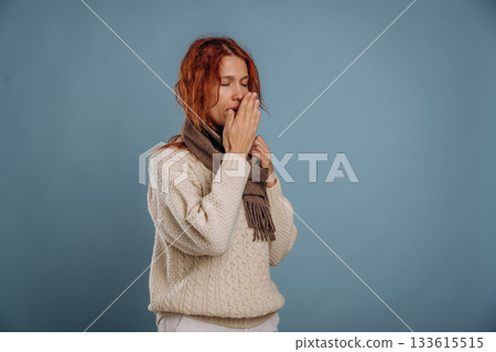 Unhealthy, feeling sick. Woman is in the studio against background Unhealthy, feeling sick. Woman is in the studio against background 133615515