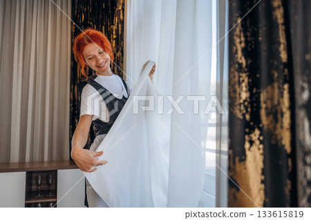 Maid is working in modern hotel room Maid is working in modern hotel room 133615819