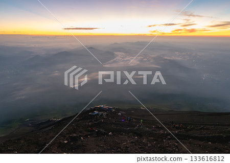 On Mount Fuji, Kitayama, Fujinomiya, Shizuoka, Japan, Sunset view over misty mountains from rocky hilltop landscape On Mount Fuji, Kitayama, Fujinomiya, Shizuoka, Japan, Sunset view over misty mountains from rocky hilltop landscape 133616812