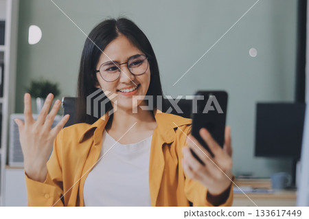 Business woman using calculator for do math finance on wooden desk in office and business working background, tax, accounting, statistics and analytic research concept. 133617449