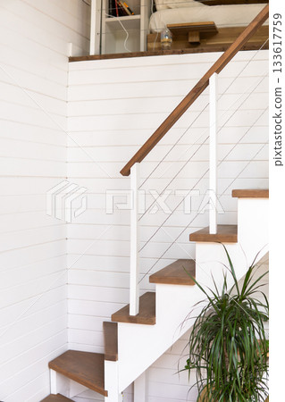 Minimal white wooden staircase in cozy natural home interior 133617759