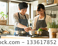 Couple enjoying cooking in the kitchen 133617852