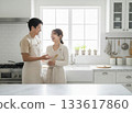 Happy couple in a bright kitchen 133617860