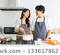 Couple to cook in the kitchen 133617862