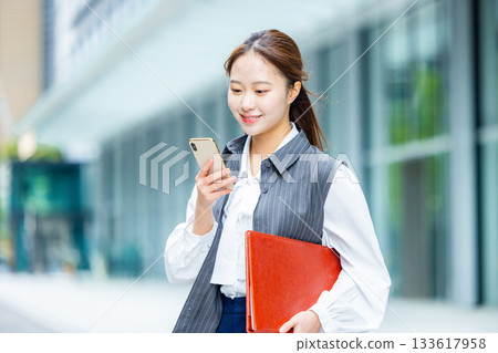 Businesswoman in an office district Businesswoman in an office district 133617958