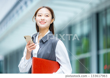 Businesswoman in an office district Businesswoman in an office district 133617963