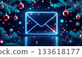 Glowing envelope amid festive Christmas ornaments and pine needles 133618177