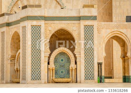 Decorative arch and mosaic fountain of the Hassan II Mosque with carved stone details and traditional Moroccan zellij tilework, Casablanca, Morocco 133618266
