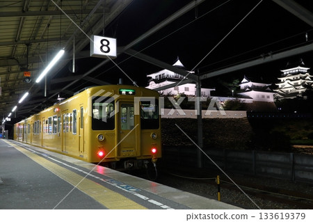 Fukuen Line 105 series train and Fukuyama Castle parked at Fukuyama Station at night Fukuen Line 105 series train and Fukuyama Castle parked at Fukuyama Station at night 133619379