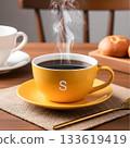 Yellow coffee cup with steam and saucer on burlap yellow cup hot drink 133619419