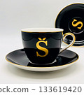 Black teacup and saucer with gold letter S and trim image 133619420