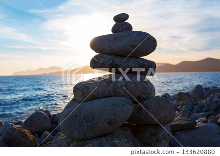 Ibiza Cap des Falco beach sunset with desire stones Ibiza Cap des Falco beach sunset with desire stones 133620880