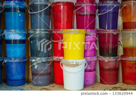 Colorful ink paint bottles in a row stacked Colorful ink paint bottles in a row stacked 133620944