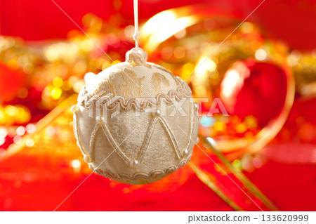 Christmas card of white velvet bauble on red Christmas card of white velvet bauble on red 133620999