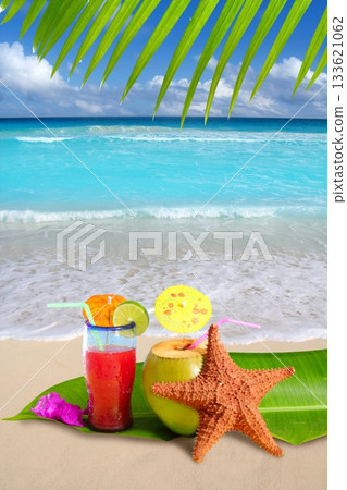 coconut red cocktail with starfish in tropical beach coconut red cocktail with starfish in tropical beach 133621062