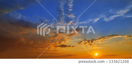 sunset sky in orange and blue 133621208