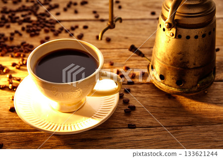 Coffee with vintage machine on aged wood 133621244