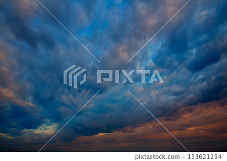 Dramatic sky with stormy clouds in sunset 133621254