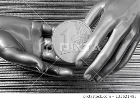 silver euro coins in futuristic robot hands 133621485