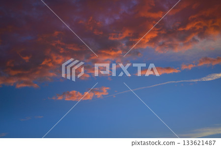 Sunset sky clouds orange and blue Sunset sky clouds orange and blue 133621487