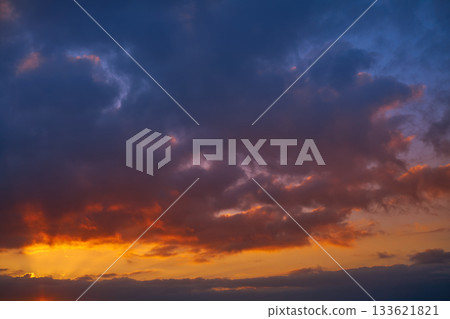 Sunset sky clouds orange and blue Sunset sky clouds orange and blue 133621821