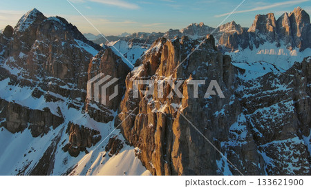 Rocky snow mountains at sunrise aerial Rocky snow mountains at sunrise aerial 133621900