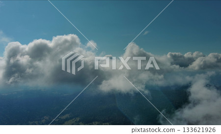 Clouds and mountains, flying in clouds 133621926