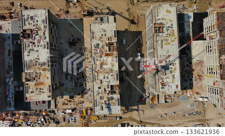 Industrial construction site with houses equipment and materials Industrial construction site with houses equipment and materials 133621936