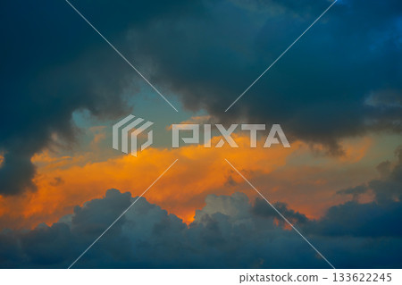 Dramatic clouds at sunset orange sky 133622245