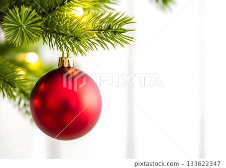 Red Christmas Ornament on Pine Branch 133622347
