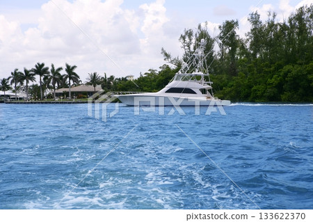 Blue waterway in Florida with fishing boat 133622370
