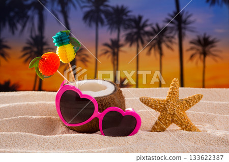 Coconut cocktail on tropical sand beach heart sunglasses Coconut cocktail on tropical sand beach heart sunglasses 133622387