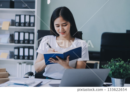 young woman reading a book young woman reading a book 133622654