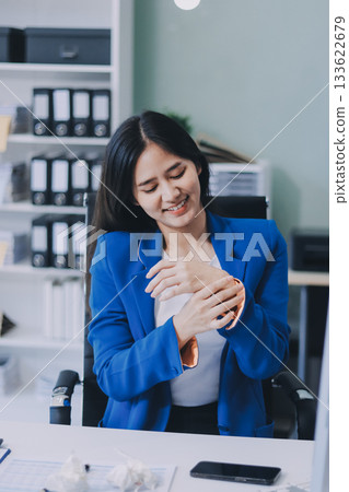 Asian women Aches from working She felt like relaxing Asian women Aches from working She felt like relaxing 133622679