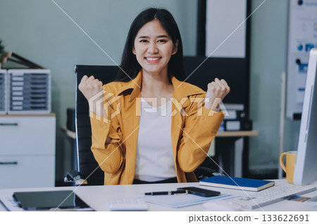 Business woman using calculator for do math finance on wooden desk in office and business working background, tax, accounting, statistics and analytic research concept. Business woman using calculator for do math finance on wooden desk in office and business working background, tax, accounting, statistics and analytic research concept. 133622691