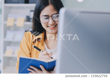 Business woman using calculator for do math finance on wooden desk in office and business working background, tax, accounting, statistics and analytic research concept. 133622750