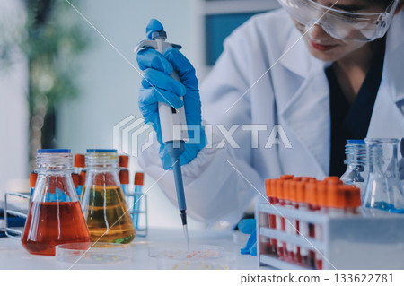 Portrait, science and happy woman on laptop in lab to research chemistry, test or innovation. Microscope, scientist and face of medical doctor in goggles for microbiology, healthcare or pharma study Portrait, science and happy woman on laptop in lab to research chemistry, test or innovation. Microscope, scientist and face of medical doctor in goggles for microbiology, healthcare or pharma study 133622781
