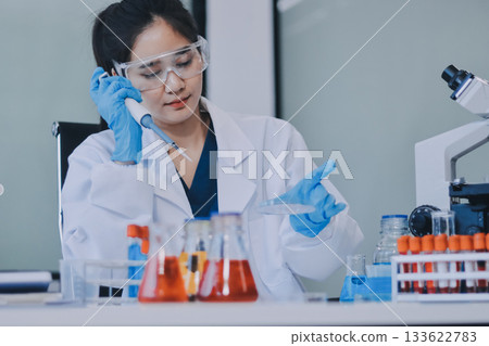 Portrait, science and happy woman on laptop in lab to research chemistry, test or innovation. Microscope, scientist and face of medical doctor in goggles for microbiology, healthcare or pharma study Portrait, science and happy woman on laptop in lab to research chemistry, test or innovation. Microscope, scientist and face of medical doctor in goggles for microbiology, healthcare or pharma study 133622783