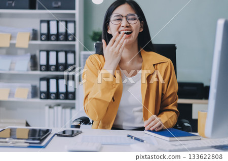 Business woman using calculator for do math finance on wooden desk in office and business working background, tax, accounting, statistics and analytic research concept. Business woman using calculator for do math finance on wooden desk in office and business working background, tax, accounting, statistics and analytic research concept. 133622808