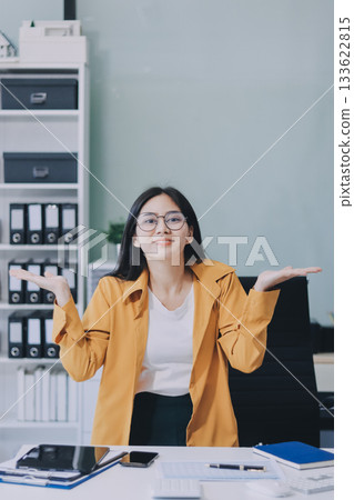Business woman using calculator for do math finance on wooden desk in office and business working background, tax, accounting, statistics and analytic research concept. Business woman using calculator for do math finance on wooden desk in office and business working background, tax, accounting, statistics and analytic research concept. 133622815