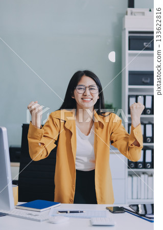 Business woman using calculator for do math finance on wooden desk in office and business working background, tax, accounting, statistics and analytic research concept. Business woman using calculator for do math finance on wooden desk in office and business working background, tax, accounting, statistics and analytic research concept. 133622816