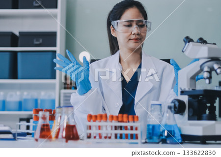 Portrait, science and happy woman on laptop in lab to research chemistry, test or innovation. Microscope, scientist and face of medical doctor in goggles for microbiology, healthcare or pharma study Portrait, science and happy woman on laptop in lab to research chemistry, test or innovation. Microscope, scientist and face of medical doctor in goggles for microbiology, healthcare or pharma study 133622830